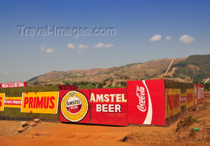 burundi80: Rutana province, Burundi: Primus and Amstel beers sponsor a construction site wall, together with Coca-Cola - photo by M.Torres - (c) Travel-Images.com - Stock Photography agency - Image Bank