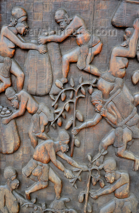 cameroon4: Cameroon, Douala: wood carving displaying native workers in the cocoa harvest - building door in downtown Douala - photo by M.Torres - (c) Travel-Images.com - Stock Photography agency - Image Bank