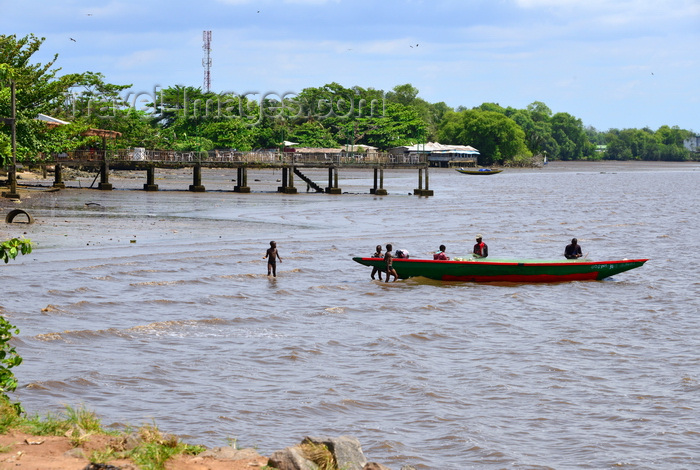 cameroon78: Cameroon, Douala: fishermen and their wooden boat with pier in the background - Mboussa Sengué, near Douala Naval  Base - photo by M.Torres - (c) Travel-Images.com - Stock Photography agency - Image Bank