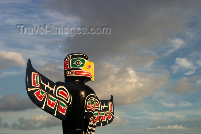 canada3: Vancouver, BC, Canada: colorful totem pole against dramatic cloudy sky - carved by native Indian Wade Baker, Skyspirit Studios, North Vancouver - Property released - photo by D.Smith - (c) Travel-Images.com - Stock Photography agency - Image Bank