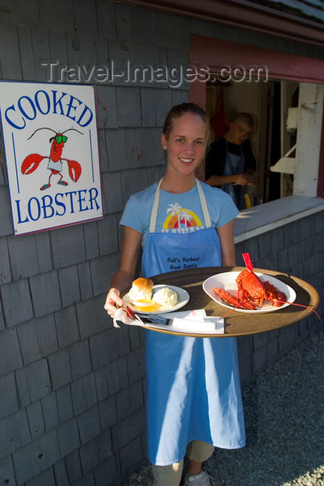 canada410: Waitress serving lobster at a restaurant in the fishing village of Halls Harbour, Nova Scotia, Canada. Model released. - photo by D.Smith - (c) Travel-Images.com - Stock Photography agency - Image Bank