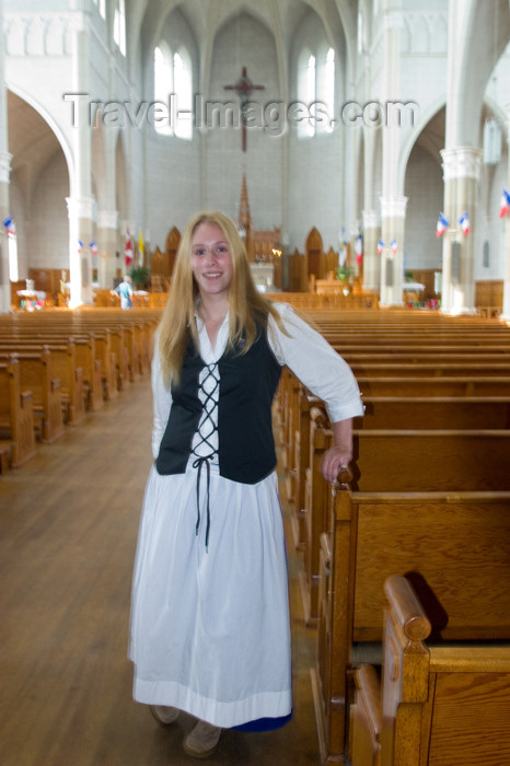 canada425: Young woman drssed in Acadian custume in a church in Metaghan, Acadian region of Nova Scotia, Canada - photo by D.Smith - (c) Travel-Images.com - Stock Photography agency - Image Bank