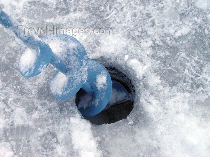 canada518: Northwest Territories, Canada: ice fishing - ice auger - hole drilled in the ice - photo by Air West Coast - (c) Travel-Images.com - Stock Photography agency - Image Bank