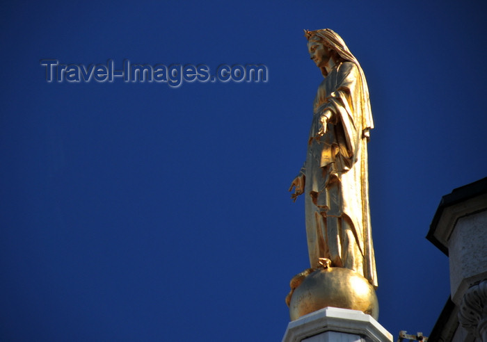 canada562: Montreal, Quebec, Canada: gilded statue of Our Lady of Lourdes atop the façade of the Chapelle Notre-Dame de Lourdes - architect Napoléon Bourassa - Rue Ste-Catherine Est, Quartier Latin - photo by M.Torres - (c) Travel-Images.com - Stock Photography agency - Image Bank