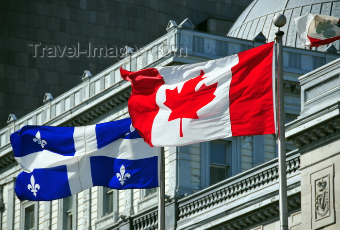 canada574: Montreal, Quebec, Canada: Canadian and Quebecer flags in front of the old Palace of Justice - Vieux palais de justice - Rue Notre Dame - Vieux-Montréal - photo by M.Torres - (c) Travel-Images.com - Stock Photography agency - Image Bank