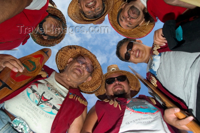 canada671: Vancouver, BC, Canada: group of North American Indians with smiling faces and wearing tradional native dress and ceremonial hats in a circle looking down at camera - Squamishnation ceremony in West Vancouver - photo by D.Smith - (c) Travel-Images.com - Stock Photography agency - Image Bank