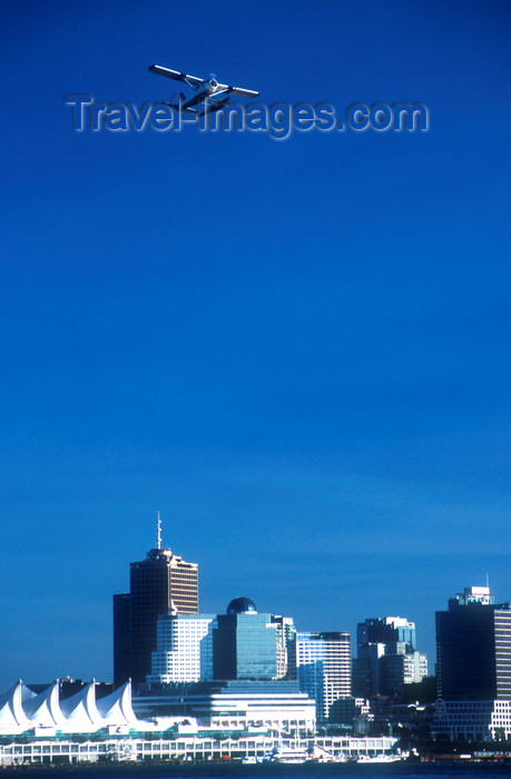 canada674: Vancouver, BC, Canada: floatplane flying in Burrard Inlet - city skyline - photo by D.Smith - (c) Travel-Images.com - Stock Photography agency - Image Bank