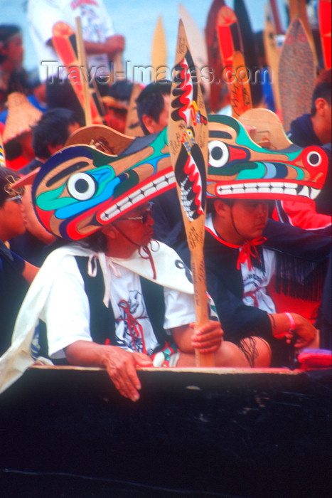 canada678: Vancouver, BC, Canada: Native North Amerian Indians wearing Indian art headgear in war canoes during canoe gathering at Capilano River, West Vancouver - photo by D.Smith - (c) Travel-Images.com - Stock Photography agency - Image Bank