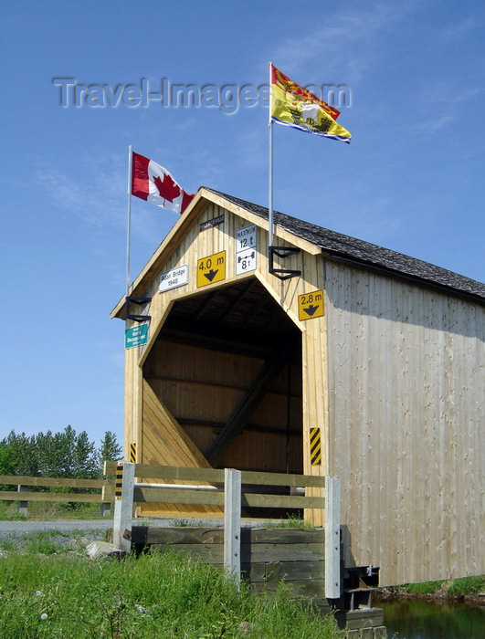 canada750: Adair, Carleton County, New Brunswick, Canada: Adair Covered Bridge - Canada and NB flags - Howe Truss - photo by G.Frysinger - (c) Travel-Images.com - Stock Photography agency - Image Bank