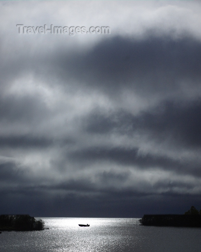 canada90: Canada / Kanada - Saskatchewan: fishing boat - reflections of a cloudy sky in this prairie lake just before a storm - photo by M.Duffy - (c) Travel-Images.com - Stock Photography agency - Image Bank