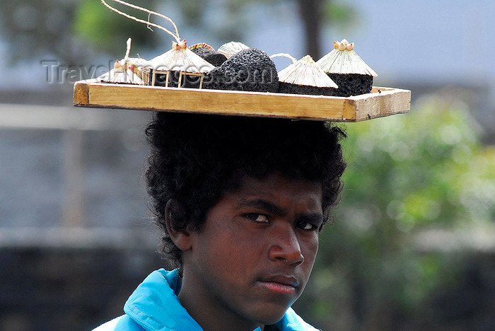 capeverde74: Fogo natural park, Fogo island - Cape Verde / Cabo Verde: boy selling lava handicraft - photo by E.Petitalot - (c) Travel-Images.com - Stock Photography agency - Image Bank