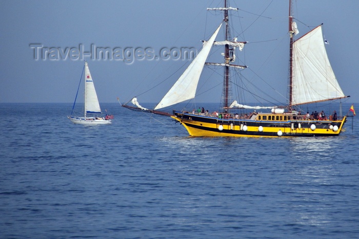 catalon149: Barcelona, Catalonia: sailing boats pass in front of Barceloneta - photo by M.Torres - (c) Travel-Images.com - Stock Photography agency - Image Bank