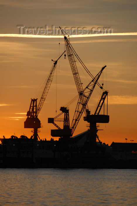 catalon158: Barcelona, Catalonia: harbour cranes and red sky - photo by T.Marshall - (c) Travel-Images.com - Stock Photography agency - Image Bank