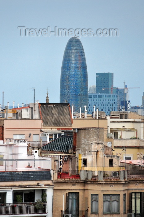 catalon211: Barcelona, Catalonia: Jean Nouvel's Agbar tower and other modern buildings seen with old residential buildings in the foreground - photo by M.Torres - (c) Travel-Images.com - Stock Photography agency - Image Bank