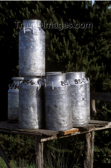 chile207: Chiloé island, Los Lagos Region, Chile: milk cans await pick up on a country - dairy industry - photo by C.Lovell - (c) Travel-Images.com - Stock Photography agency - Image Bank