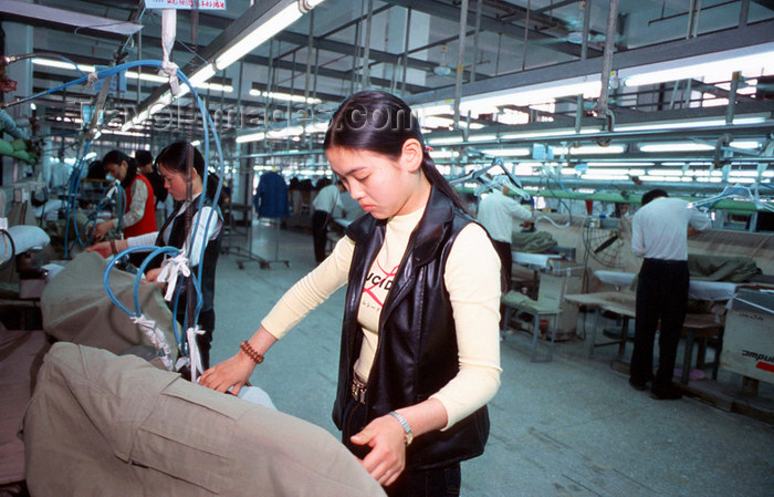 china257: Dongguan, Guangdong province, China: Chinese factory workers ironing - textile factory - photo by B.Henry - (c) Travel-Images.com - Stock Photography agency - Image Bank