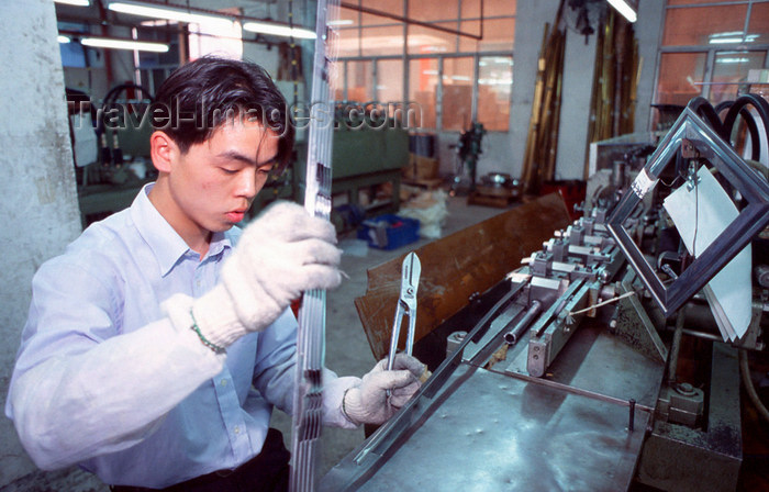 china258: Dongguan, Guangdong province, China: Chinese factory worker with  pliers - photo by B.Henry - (c) Travel-Images.com - Stock Photography agency - Image Bank
