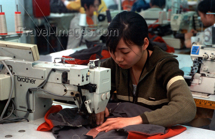 china259: Dongguan, Guangdong province, China: seamstress using a sewing machine - Chinese factory worker - photo by B.Henry - (c) Travel-Images.com - Stock Photography agency - Image Bank