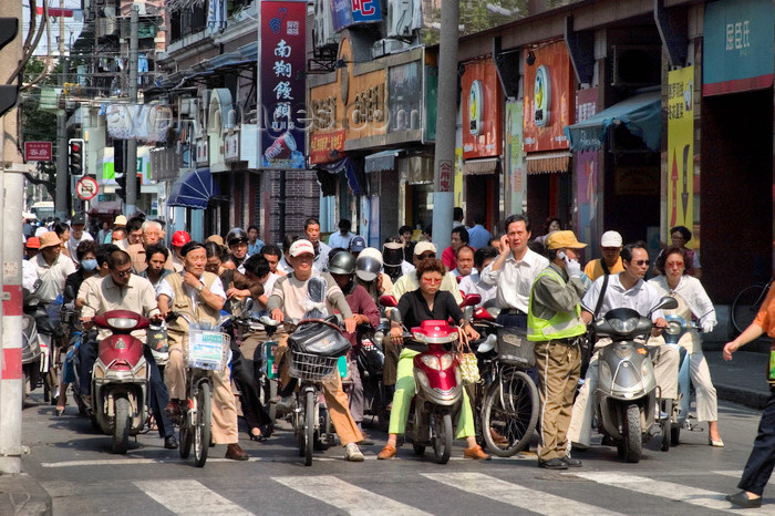 china262: Shanghai, China: crowd of bicycles and motorbikes at a traffic light - photo by Y.Xu - (c) Travel-Images.com - Stock Photography agency - Image Bank