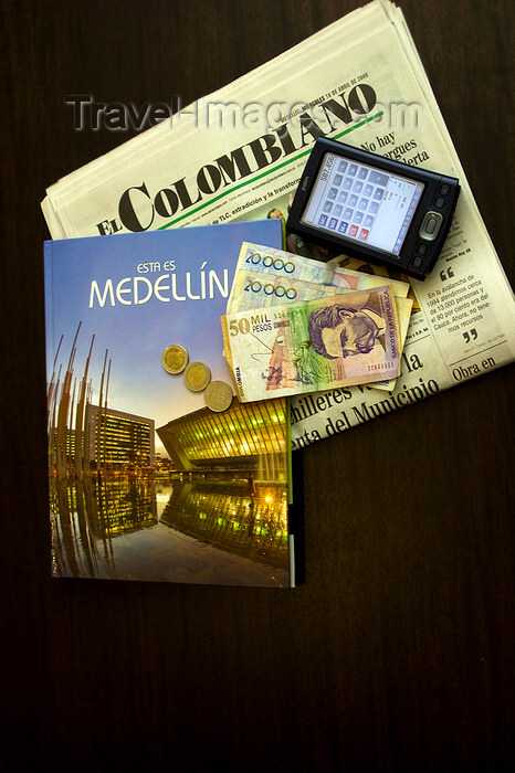 colombia28: Medellín, Colombia: a traveller's accessories - Meddllín guide, PDA, Colombian Pesos, El Colombiano newspaper - photo by E.Estrada - (c) Travel-Images.com - Stock Photography agency - Image Bank