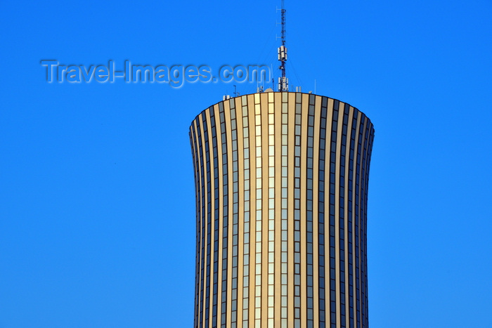 congo33: Brazzaville, Congo: Nabemba tower / Tour Nabemba, aka Elf Tower, built by Elf Aquitaine Congo, houses the offices of Total, the French Supermajor oil company, that took over Elf - skyscraper by architect Jean Marie Legrand - this concave cylinder is the tallest building in Congo, Poto-Poto - photo by M.Torres - (c) Travel-Images.com - Stock Photography agency - Image Bank
