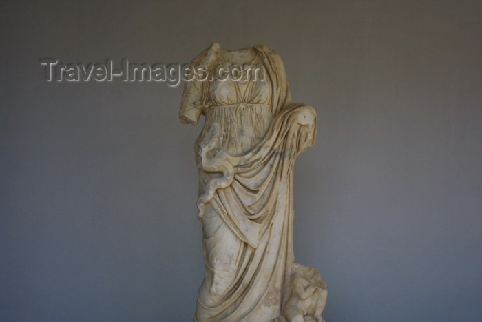 crete149: Crete, Greece - Gortys / Gortis (Heraklion prefecture): classical elegance - armless statue, with snake (photo by A.Stepanenko) - (c) Travel-Images.com - Stock Photography agency - Image Bank