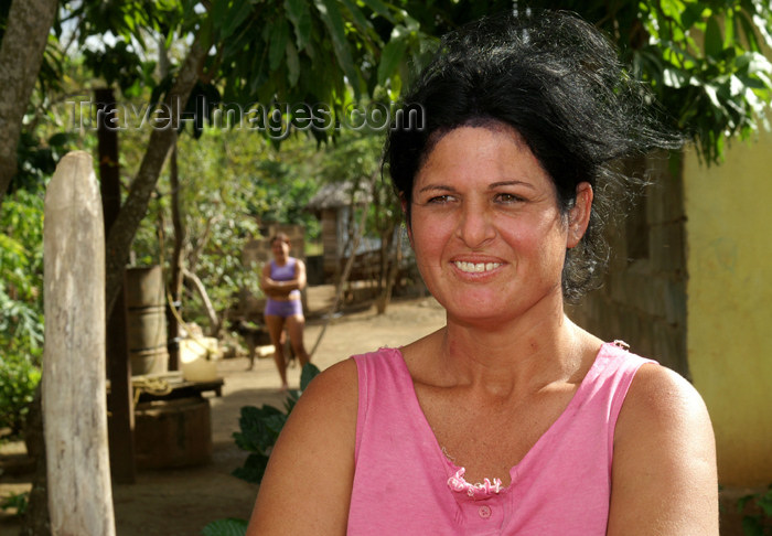 cuba105: Cuba - Holguín province - mother with pink shirt, daughter in the background - photo by G.Friedman - (c) Travel-Images.com - Stock Photography agency - Image Bank