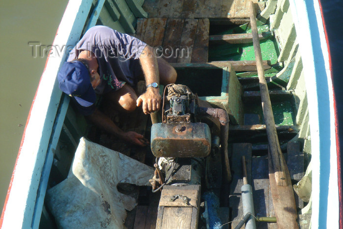 cuba40: Cuba - Guardalavaca - fixing a boat engine - photo by G.Friedman - (c) Travel-Images.com - Stock Photography agency - Image Bank