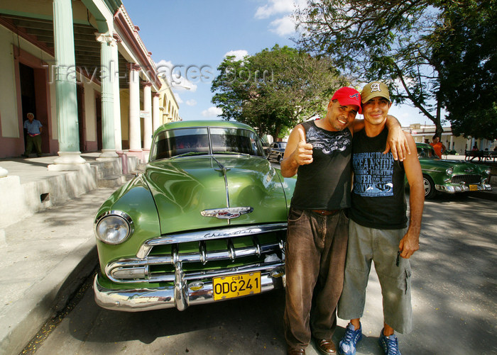 cuba69: Cuba - Holguín - Green Chevy and young owners  - photo by G.Friedman - (c) Travel-Images.com - Stock Photography agency - Image Bank