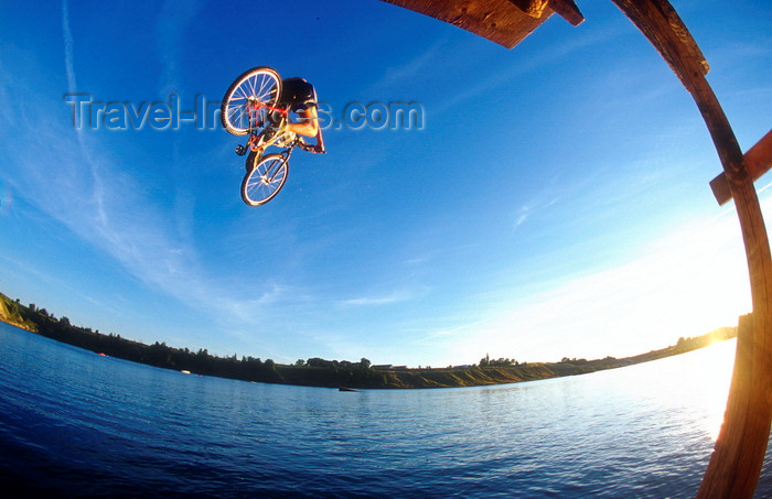 denmark22: Denmark, Copenhagen: mountain biker jumping over the water - photo by S.Egeberg - (c) Travel-Images.com - Stock Photography agency - Image Bank