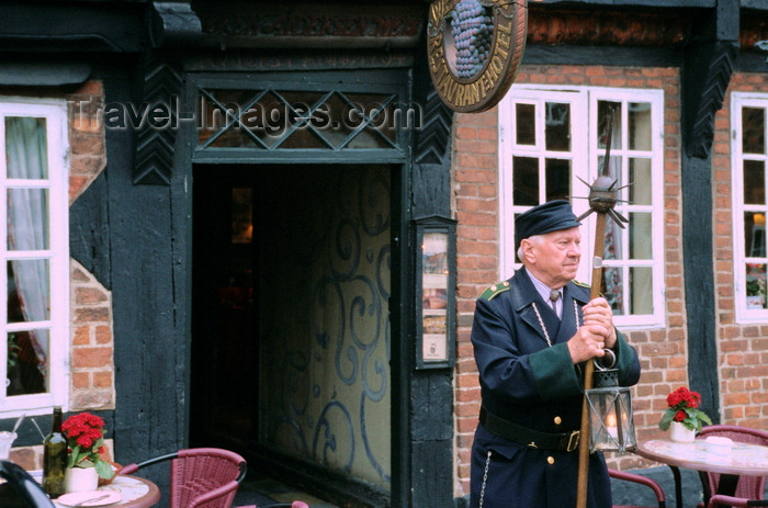 denmark37: Ribe, southwest Jutland, Denmark: guardian with medieval weapon standing in front of restaurant - spiked club called a 'morning star'
 - photo by K.Gapys - (c) Travel-Images.com - Stock Photography agency - Image Bank