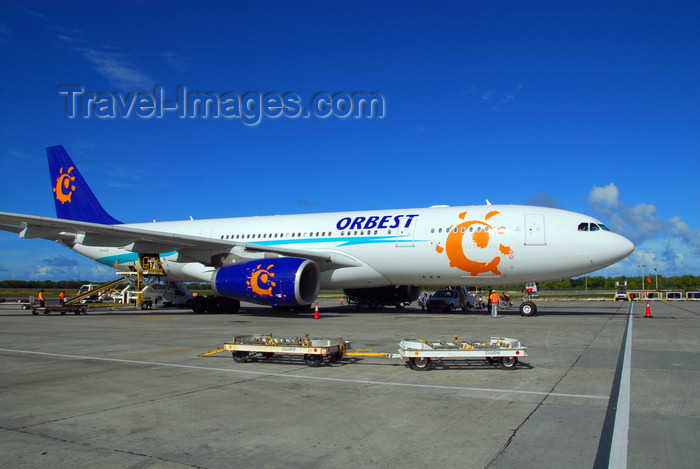 dominican187: Punta Cana, Dominican Republic: Orbest Airbus A330-200 CS-TRA and trolleys on the ramp - Punta Cana International Airport - PUJ / MDPC - photo by M.Torres - (c) Travel-Images.com - Stock Photography agency - Image Bank