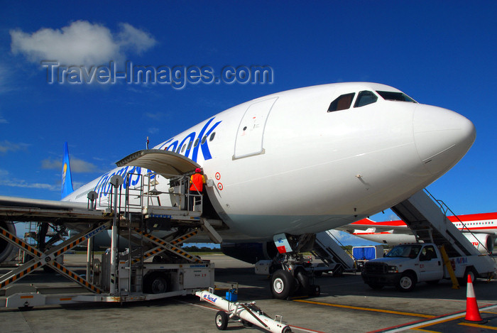 dominican190: Punta Cana, Dominican Republic: Thomas Cook Airlines Airbus A330-243 G-OJMC with cargo platform - Punta Cana International Airport - PUJ / MDPC - photo by M.Torres - (c) Travel-Images.com - Stock Photography agency - Image Bank