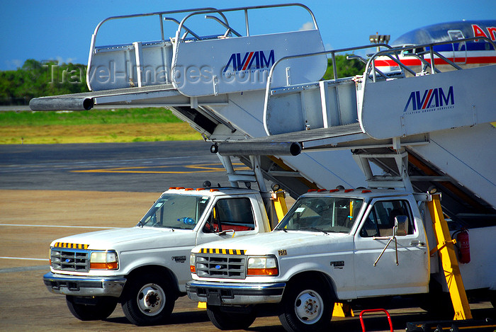 dominican196: Punta Cana, Dominican Republic: AVIAM ground services passenger boarding stairs (air-stairs) on Ford F-380 trucks - cabins - Punta Cana International Airport - PUJ / MDPC - photo by M.Torres - (c) Travel-Images.com - Stock Photography agency - Image Bank