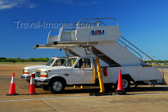 dominican199: Punta Cana, Dominican Republic: AVIAM ground services passenger boarding stairs (air-stairs) on Ford F-380 trucks - Punta Cana International Airport - PUJ / MDPC - photo by M.Torres - (c) Travel-Images.com - Stock Photography agency - Image Bank