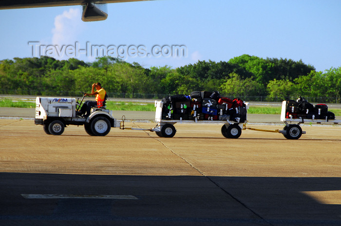 dominican203: Punta Cana, Dominican Republic: baggage train - TUG Technologies Corporation MA Tow Tractor - Punta Cana International Airport - PUJ / MDPC - photo by M.Torres - (c) Travel-Images.com - Stock Photography agency - Image Bank