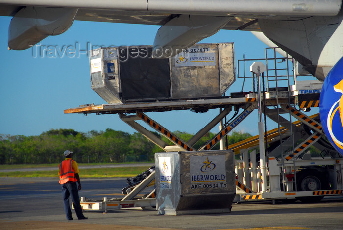 dominican206: Punta Cana, Dominican Republic: cargo - container loader - type AKE Unit Load Devices (ULDs) being loaded into an Iberworld Airbus A330-322 - Punta Cana International Airport - PUJ / MDPC - photo by M.Torres - (c) Travel-Images.com - Stock Photography agency - Image Bank