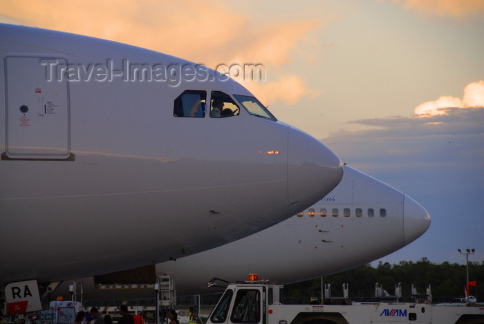 dominican209: Punta Cana, Dominican Republic: aircraft noses - Airbus A330-200 and Boeing 747-341 - Punta Cana International Airport - PUJ / MDPC - photo by M.Torres - (c) Travel-Images.com - Stock Photography agency - Image Bank