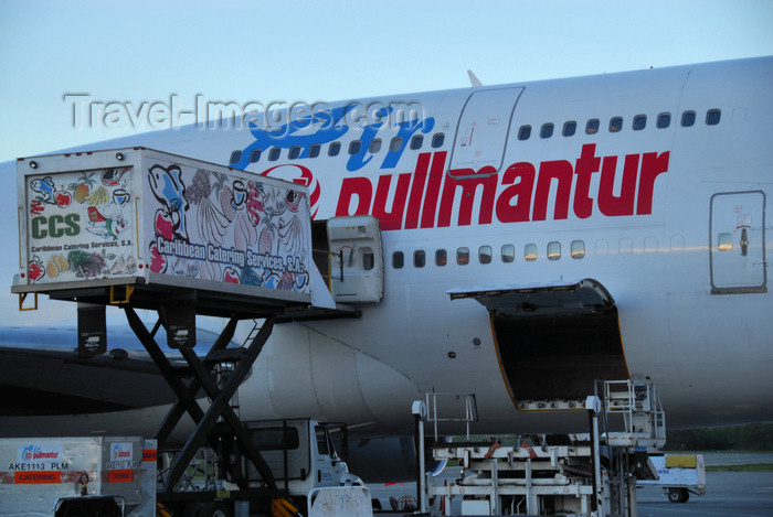 dominican211: Punta Cana, Dominican Republic: Air Pullmantur Boeing 747-341 EC-IOO - catering truck and open baggage hold / cargo bin - Punta Cana International Airport - PUJ / MDPC - photo by M.Torres - (c) Travel-Images.com - Stock Photography agency - Image Bank