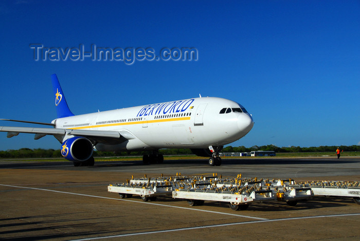 dominican215: Punta Cana, Dominican Republic: Iberworld Airbus A330-322 EC-IJH and trolleys for containers and palettes - Punta Cana International Airport - PUJ / MDPC - photo by M.Torres - (c) Travel-Images.com - Stock Photography agency - Image Bank