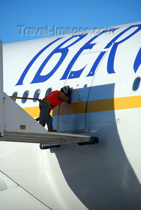 dominican218: Punta Cana, Dominican Republic: Iberworld Airbus A330-322 EC-IJH - catering worker tries to get the crew's attention - Punta Cana International Airport - PUJ / MDPC - photo by M.Torres - (c) Travel-Images.com - Stock Photography agency - Image Bank