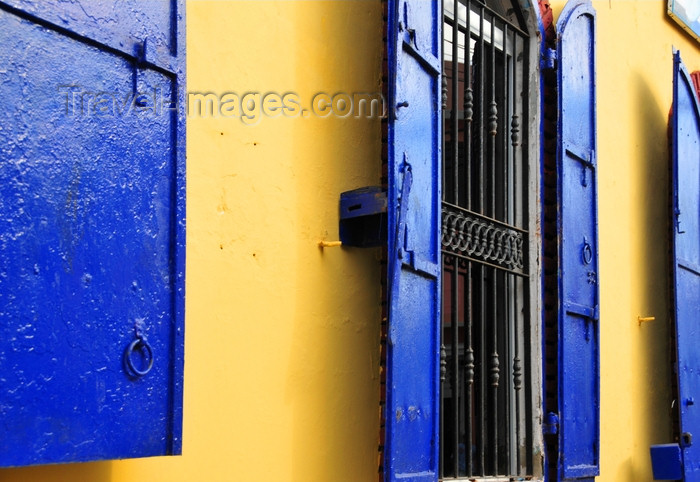 dominican282: Puerto Plata, Dominican republic: yellow wall and windows with blue shutters - photo by M.Torres - (c) Travel-Images.com - Stock Photography agency - Image Bank