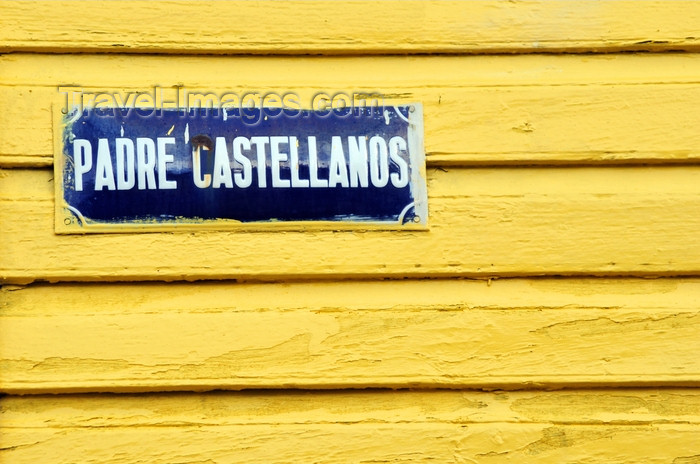 dominican293: Puerto Plata, Dominican republic: street sign on yellow wall - Calle Padre Castellanos - photo by M.Torres - (c) Travel-Images.com - Stock Photography agency - Image Bank