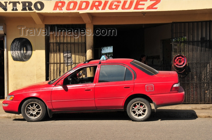 dominican327: Gaspar Hernández, Espaillat province, Dominican republic: a public taxi stops to repair a tyre - photo by M.Torres - (c) Travel-Images.com - Stock Photography agency - Image Bank