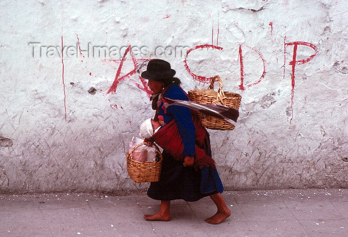 ecuador36:  Ecuador - Quito: Indian woman with child and baskets  - street with CDP graffiti - photo by J.Fekete - (c) Travel-Images.com - Stock Photography agency - Image Bank