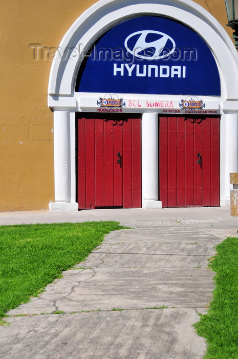 ecuador68: Quito, Ecuador: Quito Bullring - Plaza de Toros de Quito - separate doors for seats in the sun and in the shade - Hyundai sponsorship - photo by M.Torres - (c) Travel-Images.com - Stock Photography agency - Image Bank