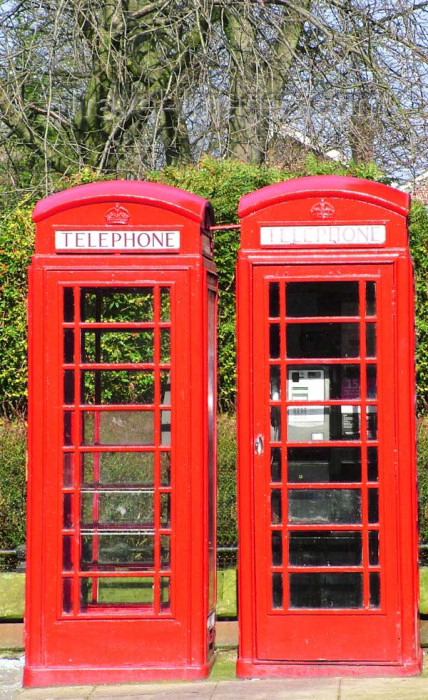 england302: Warrington, Cheshire, England, UK: twin Telephone Boxes, Sankey Street - public phones - phone booths - quintessential British red phone box, designed by Sir Giles Gilbert Scott, English architect - K6 - photo by D.Jackson - (c) Travel-Images.com - Stock Photography agency - Image Bank