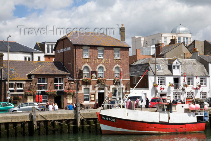 england561: Weymouth, Dorset, England: fishing boat and the George Inn - photo by I.Middleton - (c) Travel-Images.com - Stock Photography agency - Image Bank