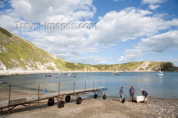 england571: Lulworth Cove, Dorset, England: men dragging boat up beach - photo by I.Middleton - (c) Travel-Images.com - Stock Photography agency - Image Bank