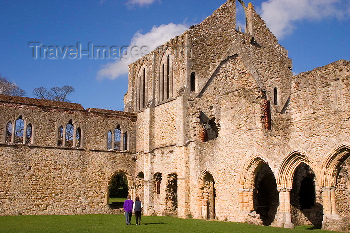 england665: Netley, Hampshire, South East England, UK: Netley Abbey - couple holding hands walking towards ruins - cloister showing the south transept of the church and the east range - photo by I.Middleton - (c) Travel-Images.com - Stock Photography agency - Image Bank